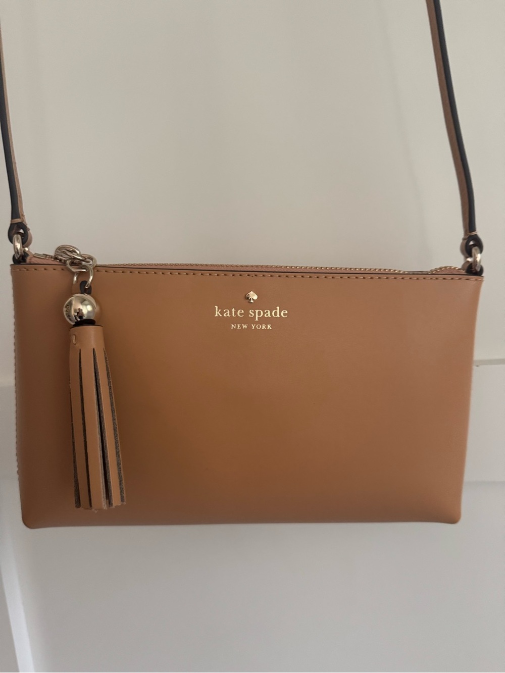 Kate Spade Leather Crossbody Bag with Tassel, tan color (Tiramisu).